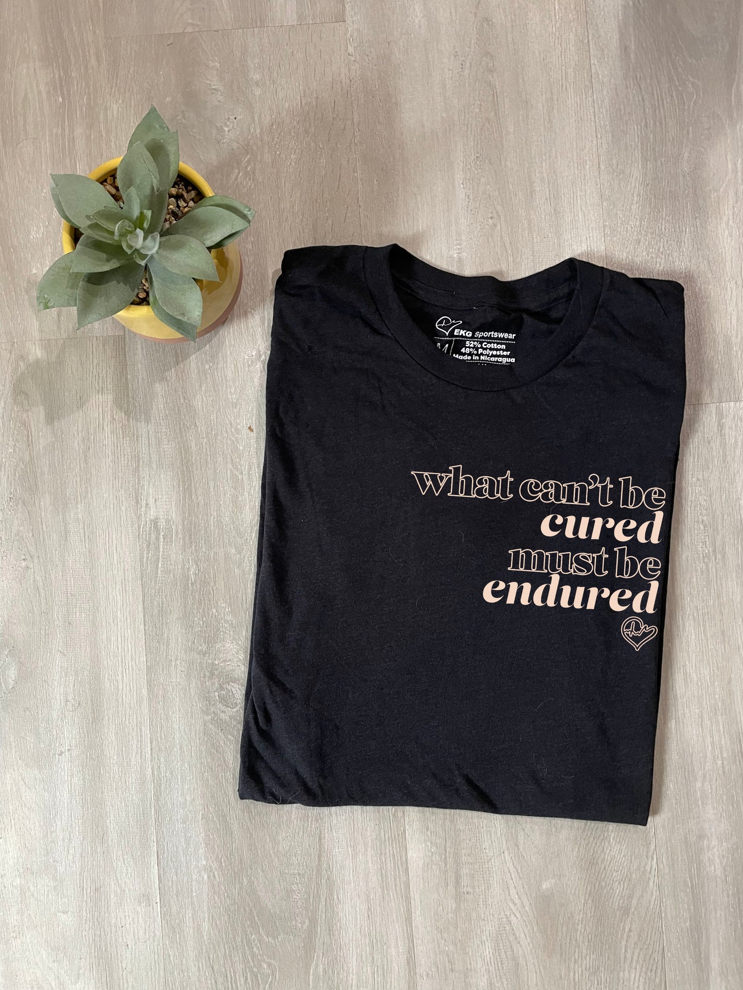 What Can't Be Cured Tee